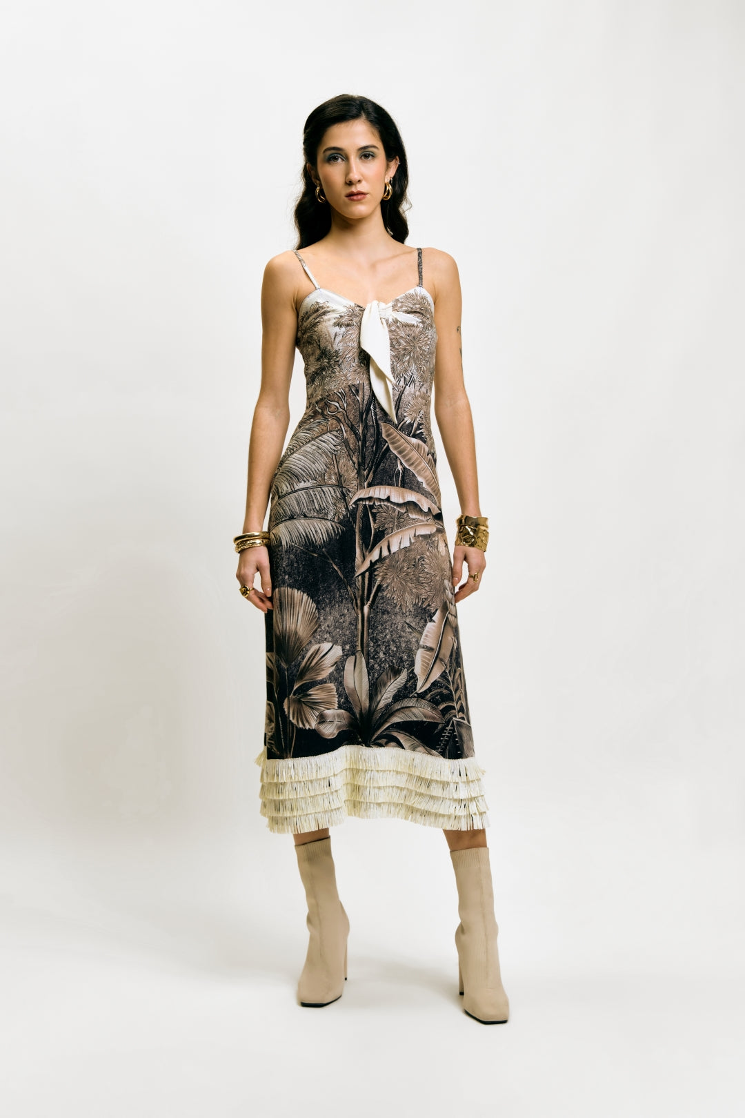 Close-up of Afterlight Dress with botanical print, front tie, and layered fringe hem