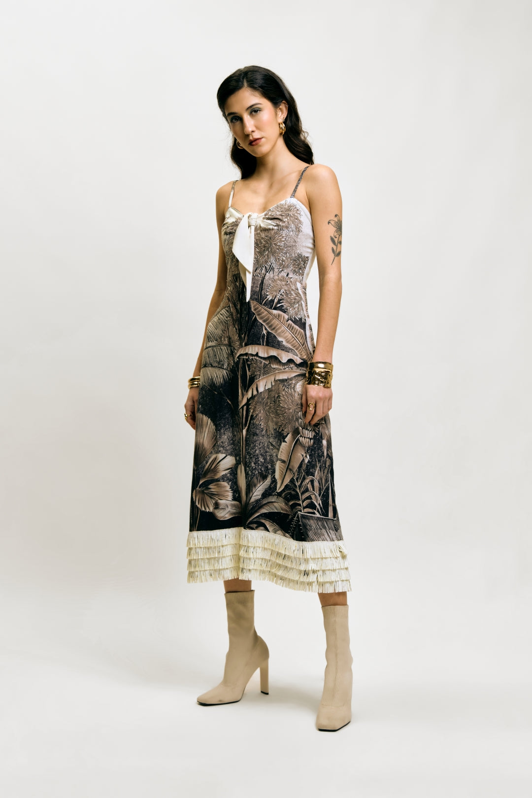 Afterlight Dress with botanical print, layered fringe hem, beige boots, and gold jewelry