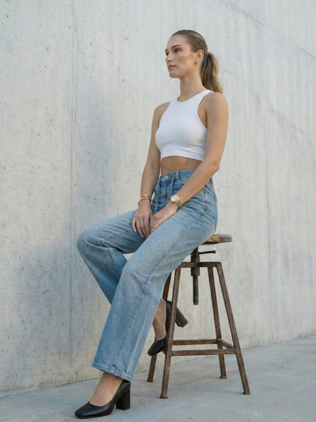 Women’s light-wash denim jeans with crystal detailing