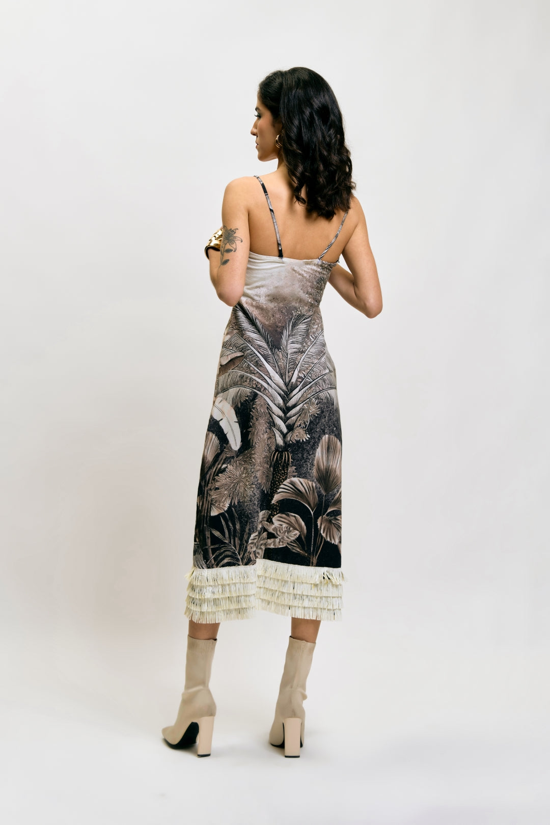 Back view of Afterlight Dress with tropical print and fringe detail