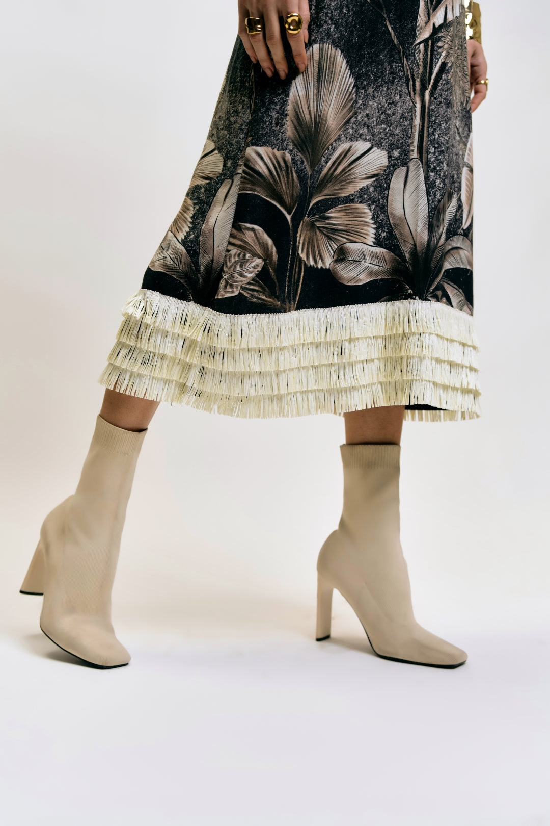 lower view of Afterlight Dress with tropical print and fringe detail